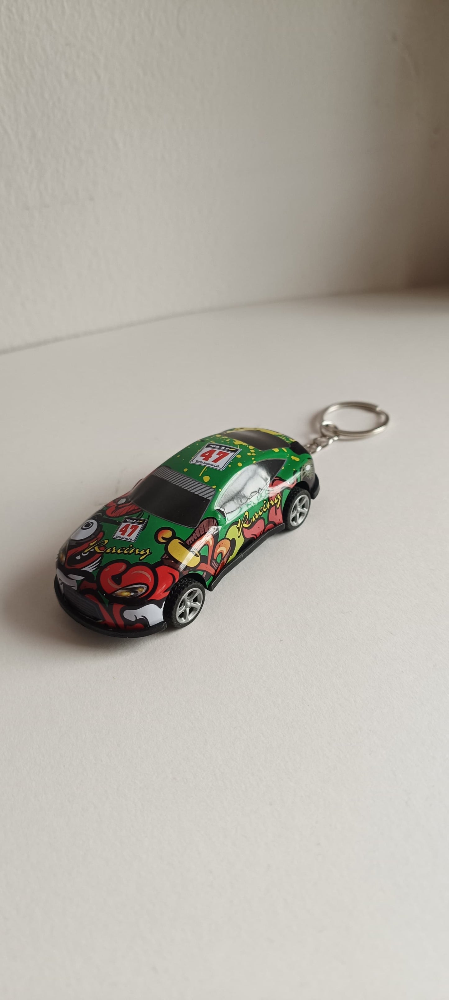 Pull back car keychain