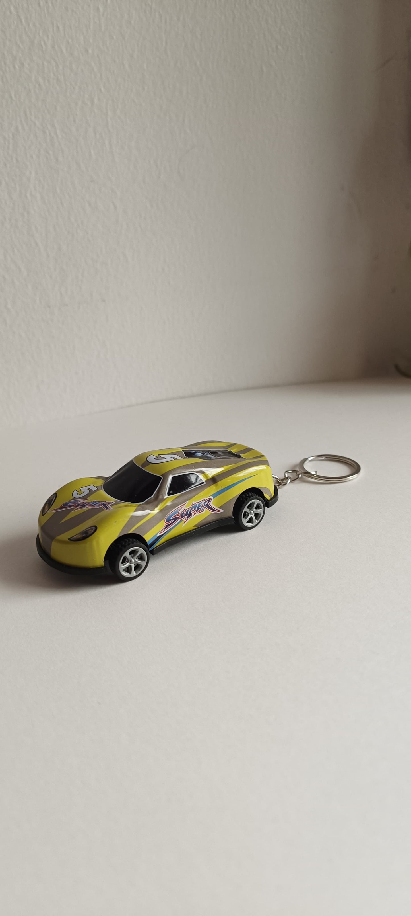 Pull back car keychain